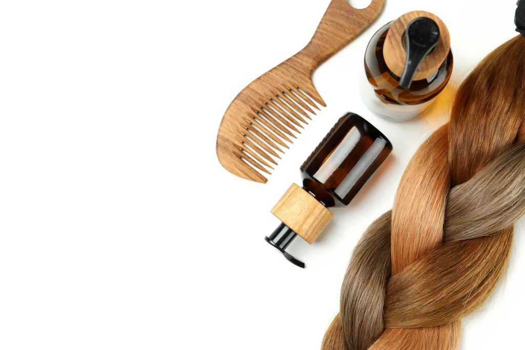 Concept of hair care on white background